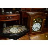 A DISTRESSED LATE 19TH CENTURY EBONISED FRENCH WALL CLOCK, together with an oak cased wall clock