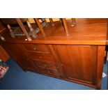 A REPRODUCTION MAHOGANY SIDEBOARD with four drawers, width 183cm x depth 50cm x height 100cm