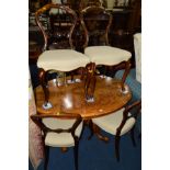 A VICTORIAN BURR WALNUT OVAL LOO TABLE on a scrolled base, width 122cm x depth 89cm x height 71cm