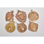 A COLLECTION OF GOLD 9CT GOLD FOBS AND PENDANTS, to include early 20th century shield fobs, engraved
