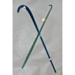 TWO GLASS CANES, a blue ribbed glass cane, length 69cm and a green barley twist glass cane, length