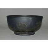 A LATE 18TH CENTURY LEEDS POTTERY BLACK BASALT FOOTED BOWL, applied with band of classical figures