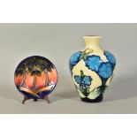 TWO PIECES MOORCROFT POTTERY, a baluster vase, blue flower decoration on cream ground, impressed