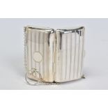 A GEORGE V SILVER PURSE, horizontal engine turned stripe decoration, leather lined interior, on