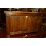 A REPRODUCTION OAK LINENFOLD BLANKET CHEST, width 76cm x depth 43cm x height 46cm