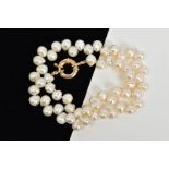 A CULTURED PEARL NECKLACE, to the circular spring release clasp stamped 375, length 38mm
