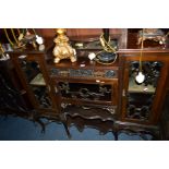 AN EDWARDIAN MAHOGANY SIDE CABINET BASE with three glazed doors, width 123cm x depth 35cm x height