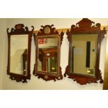 A 19TH CENTURY MAHOGANY FRETWORK BEVELLED EDGE WALL MIRROR, with shell inlay, together with two