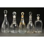 FIVE GEORGIAN GLASS DECANTERS, of various designs, four of mallet shape with flattened stoppers, one