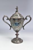 A LATE VICTORIAN SILVER PLATED TWIN HANDLED TROPHY CUP OF MILITARY INTEREST, the pull off cover with