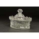 A GEORGE III IRISH CUT GLASS BUTTER DISH AND COVER, of oval form, circa 1810, Van Dyck rim, facet,