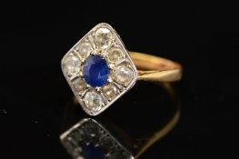 A MID 20TH CENTURY SAPPHIRE AND DIAMOND RING, the central oval sapphire within a surround of eight