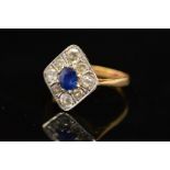 A MID 20TH CENTURY SAPPHIRE AND DIAMOND RING, the central oval sapphire within a surround of eight