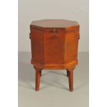 A GEORGE III AND LATER MAHOGANY OCTAGONAL WINE COOLER, the hinged top opening to reveal a