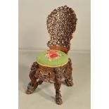 A 19TH CENTURY ANGLO INDIAN ORNATELY CARVED HARDWOOD CHAIR, the pierced back with three exotic birds