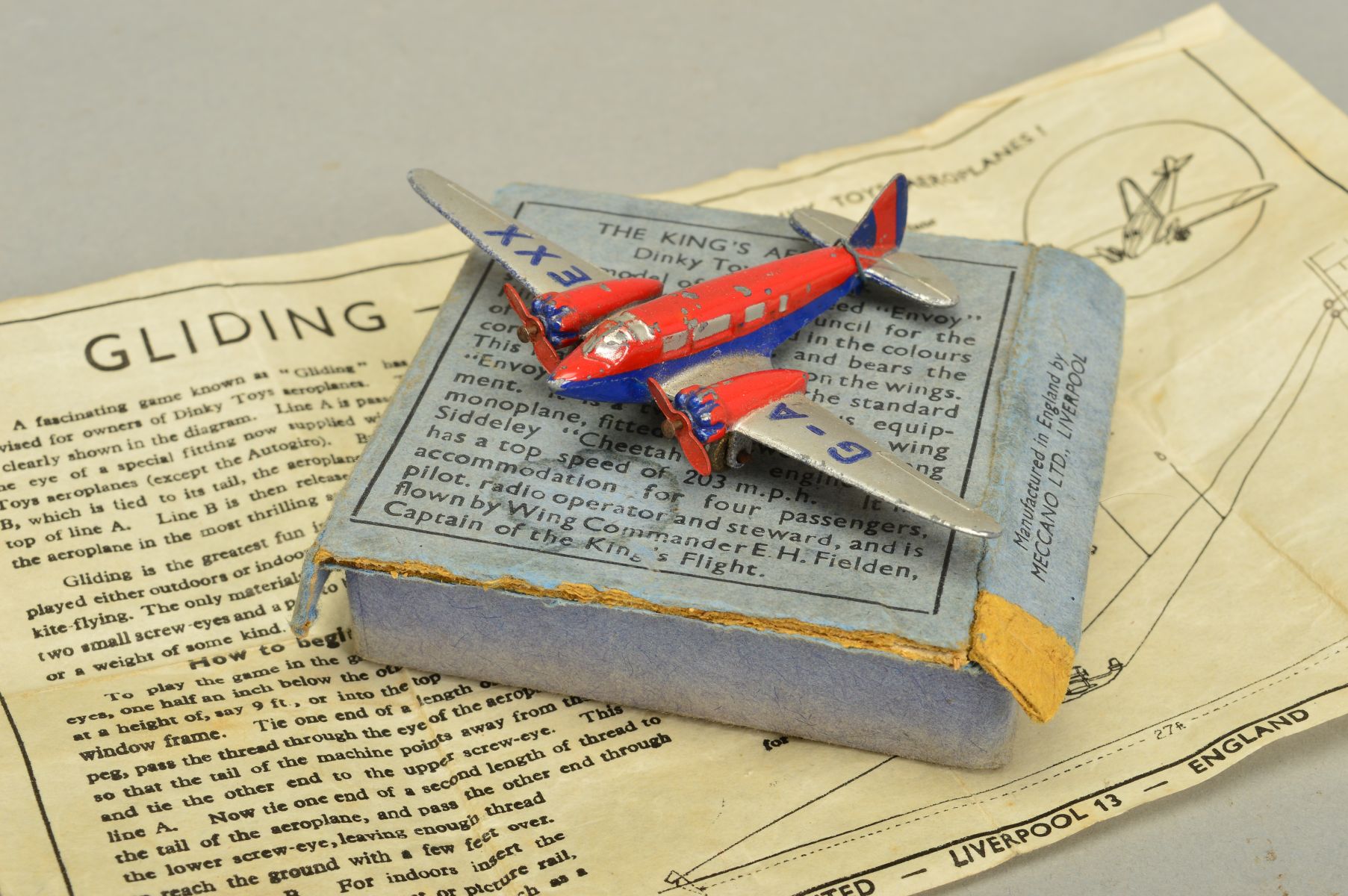 A BOXED DINKY TOYS THE KING'S AEROPLANE, No.62k, Airspeed 'Envoy' red and blue fuselage and engines,