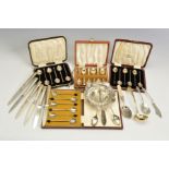 A PARCEL OF CASED SILVER COFFEE SPOONS AND OTHER FLATWARE AND CUTLERY, including two cased sets of