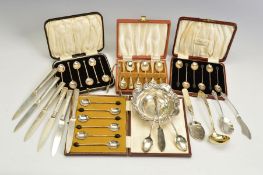 A PARCEL OF CASED SILVER COFFEE SPOONS AND OTHER FLATWARE AND CUTLERY, including two cased sets of