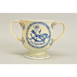 ARCHERY INTEREST, AN EARLY 19TH CENTURY PEARLWARE LOVING CUP, hand painted in underglaze blue to