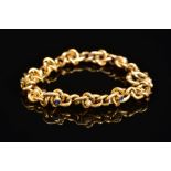 AN EARLY 20TH CENTURY GOLD, SAPPHIRE AND SEED PEARL BRACELET, designed as a twisted curb link