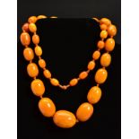 A NATURAL AMBER NECKLACE, designed as thirty-nine graduated beads measuring approximately 13mm to