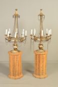 A PAIR OF 20TH CENTURY GILT METAL EIGHT LIGHT ELECTROLIERS, fitted with glass candles and mounted on