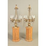 A PAIR OF 20TH CENTURY GILT METAL EIGHT LIGHT ELECTROLIERS, fitted with glass candles and mounted on