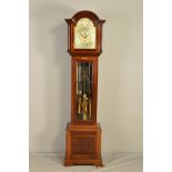 AN EARLY 20TH CENTURY MAHOGANY LONGCASE CLOCK, with tubular quarter chiming mechanism, the arched