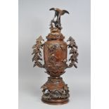 A LATE 19TH CENTURY JAPANESE BRONZE TWIN HANDLED VASE AND COVER, the cover cast as an eagle standing