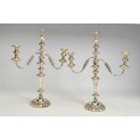 A PAIR OF VICTORIAN OLD SHEFFIELD PLATE THREE BRANCH CANDELABRA, each with detachable foliate