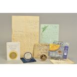 A SMALL PACKAGE OF COINS, to include a Royal Mint sealed Millennium gold half sovereign and a 1996