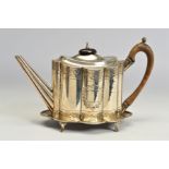 A GEORGE III SILVER TEAPOT AND STAND, of wavy oval form, bright cut engraved decoration, maker