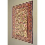 A 20TH CENTURY PERSIAN SILK TREE OF LIFE RUG, multi strap border with bands of foliate and geometric