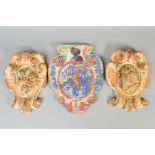 A PAIR OF 18TH CENTURY CARVED FRUITWOOD CARTOUCHE SHAPED PLAQUES, one centre carved with a