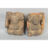 A PAIR OF 18TH CENTURY CARVED AND STAINED WOODEN CORBELS, of primitive human form, height