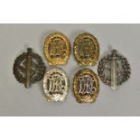 FOUR GERMAN 3RD REICH 'D.R.L' SPORT BADGES, three appear to be the bronze award with the other being