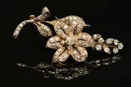 A VICTORIAN GOLD, DIAMOND FLORAL AND FOLIATE BROOCH, mounted en tremblant, the centre flower mounted