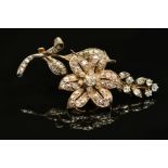 A VICTORIAN GOLD, DIAMOND FLORAL AND FOLIATE BROOCH, mounted en tremblant, the centre flower mounted