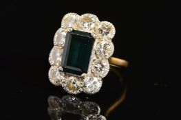 A LARGE 18CT GOLD DIAMOND AND DARK GREEN TOURMALINE CLUSTER RING, emerald cut tourmaline measuring