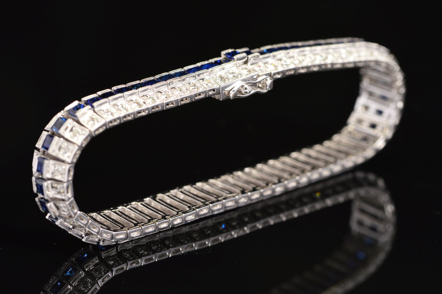 A MODERN SAPPHIRE AND DIAMOND LINE BRACELET, centring on a line of calibre square cut blue - Image 3 of 5