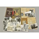 A GROUP OF 3RD REICH WWII MEDALS AND BADGES, plus paperwork relating to two members of the same