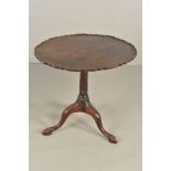 A GEORGE III MAHOGANY TILT TOP TRIPOD TABLE, the circular top with pie crust edge, on a