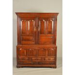 A MID 18TH CENTURY OAK PRESS CUPBOARD, ogee cornice above double doors with two fielded panels,