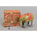 A BOXED MOKO TINPLATE CLOCKWORK JUMBO THE WALKING ELEPHANT, grey with lithographed red and white