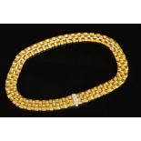 A MODERN 18CT GOLD ROBERTO COIN DIAMOND COLLAR, a wide flat panel link textured pattern with diamond