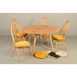 AN ERCOL BLONDE ELM OVAL DROP LEAF DINING TABLE, on four tapering legs, approximately 124cm x