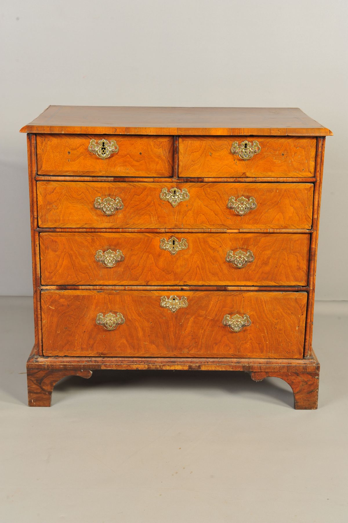 A MID 18TH CENTURY AND LATER WALNUT CHEST OF TWO SHORT OVER THREE LONG DRAWERS, feather banded inlay