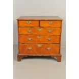 A MID 18TH CENTURY AND LATER WALNUT CHEST OF TWO SHORT OVER THREE LONG DRAWERS, feather banded inlay