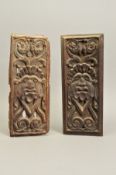 TWO CARVED TREEN PANELS, of rectangular form, 17th Century and later, carved with identical mask and