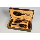 A CASED GEORGE V SILVER AND TORTOISESHELL PIQUE WORK DRESSING TABLE SET, comprising hand mirror,